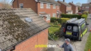 Roof cleaning in Cheshire with moss removal being carried out on a residential property in Northwich