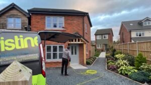 Pristine Clean window cleaner in Northwich with branded van outside semi detached house cleaning exterior windows