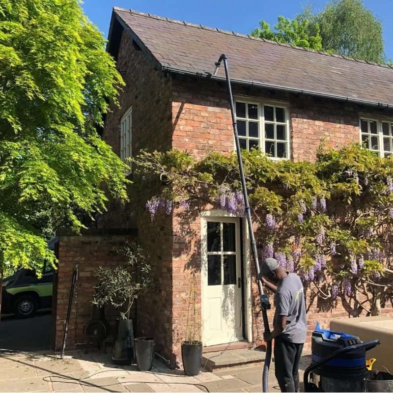 A beautiful home in cheshire having their gutters cleared by a professional cleaner from the pristine clean team.
