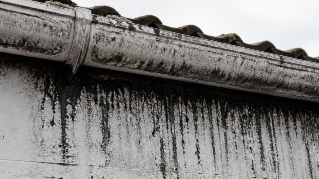 Black streaks on UPVC fascia boards caused by dirty gutter overflow on a Northwich property